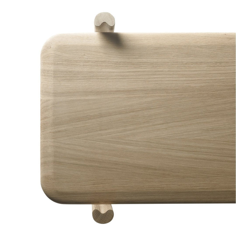 Light natural wood surface with a smooth finish and subtle grain patterns, featuring rounded corners and rounded feet.
