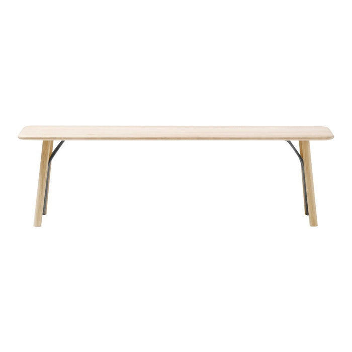 Light wood table with a smooth finish and minimalist design, featuring slim black metal legs for contrast.