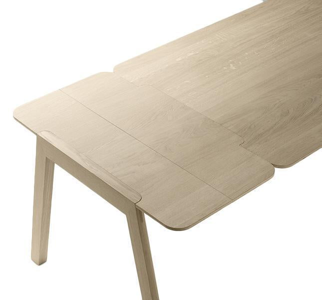Light oakwood dining table with a smooth finish and subtle grain patterns. Perfect for modern interiors.