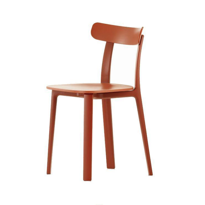 Modern orange chair with a minimalist design, featuring a solid color finish and sleek lines for a contemporary look.