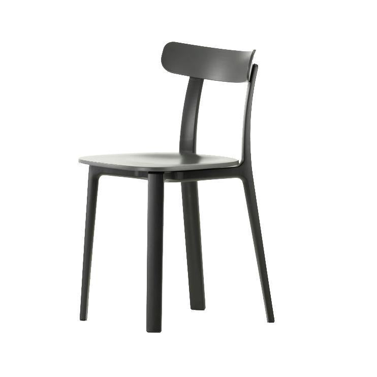 Modern black dining chair with a sleek matte finish and minimalistic design. Perfect for contemporary spaces.