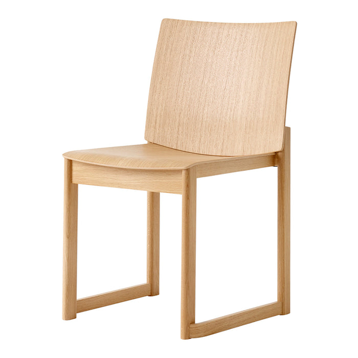 Light wood chair with a smooth, natural finish and minimalistic design, featuring subtle grain patterns.
