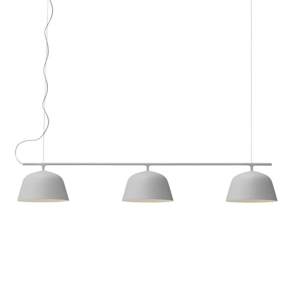Modern three-light pendant lamp in sleek white finish with smooth, rounded shades and minimalist design.