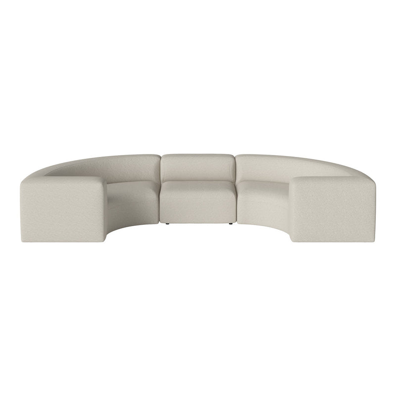 Curved sectional sofa in soft beige fabric with a textured pattern, ideal for modern living spaces.