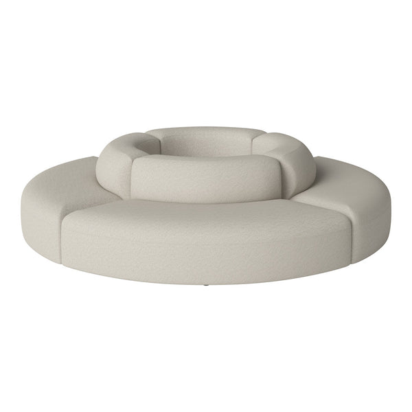 Modern circular sofa in soft beige with textured upholstery and gentle curves. Perfect for stylish living spaces.
