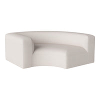 Curved white sofa with textured fabric, adding a minimalist and modern touch to any space.