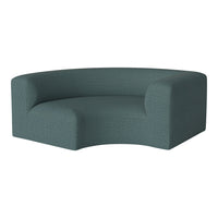 Curved teal couch with a textured pattern, offering a modern and stylish look for contemporary decor.