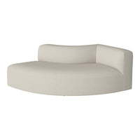 Curved cream sofa in a textured fabric with a smooth, minimalist design and subtle pattern. Perfect for modern decor.