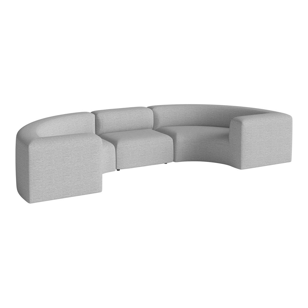 Curved sectional sofa in soft gray fabric with a smooth, modern finish and minimalistic design elements.
