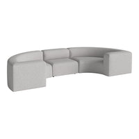 Curved grey sectional sofa with a subtle textured pattern, ideal for modern living spaces.