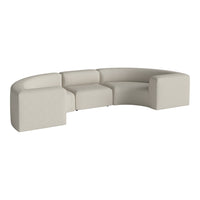 Beige curved sectional sofa with a smooth texture, offering a modern minimalist design. Ideal for stylish interiors.