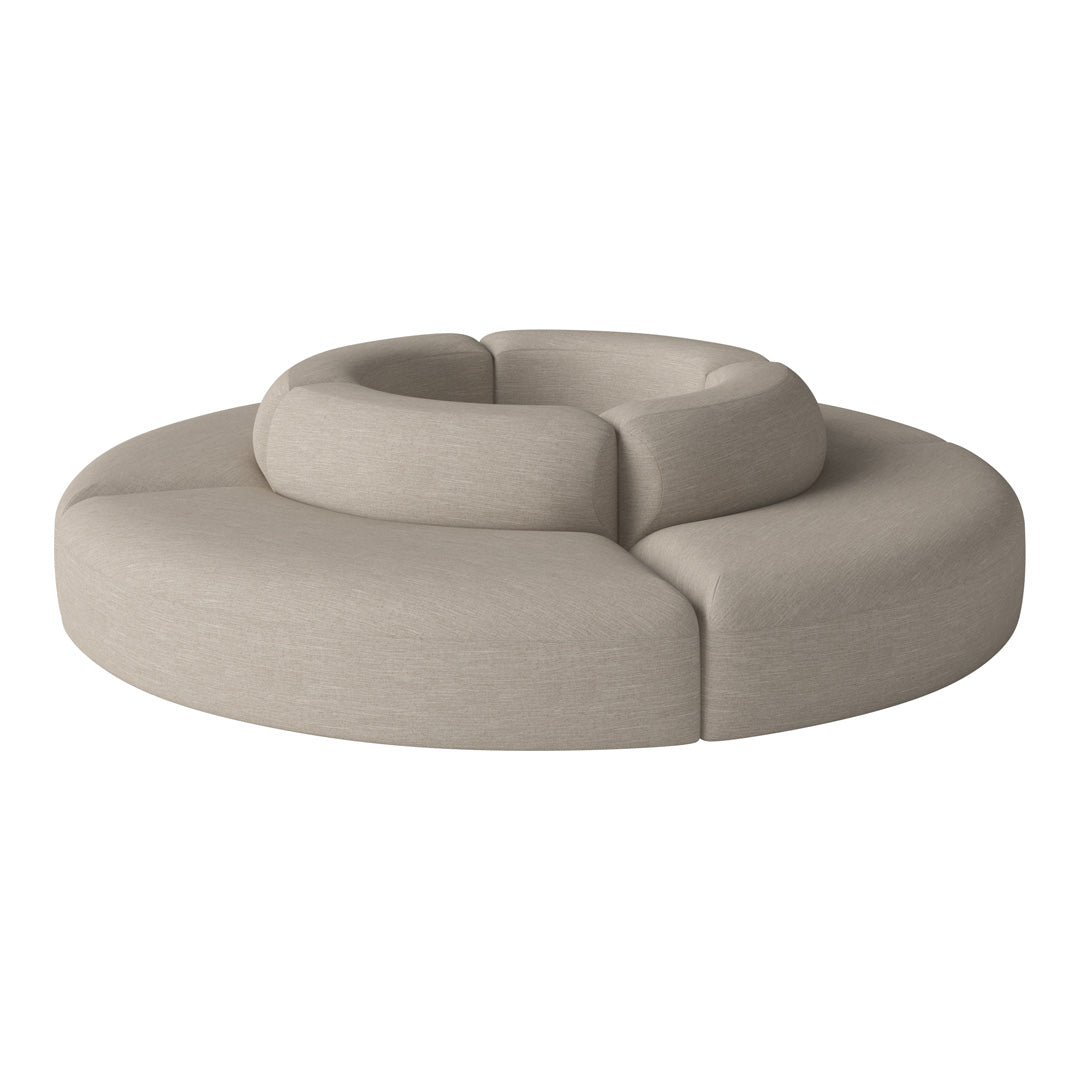 Beige circular sofa with smooth, rounded forms and a textured fabric finish. Modern and minimalist design.