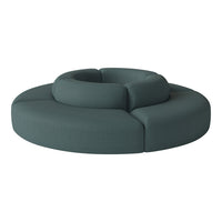Teal circular sofa with textured fabric, featuring a modern design and seamless, soft curves. Perfect for stylish interiors.