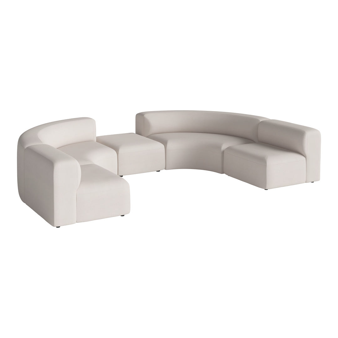 Curved modular sofa in soft white upholstery with smooth, minimalist design and no patterns, ideal for modern decor.