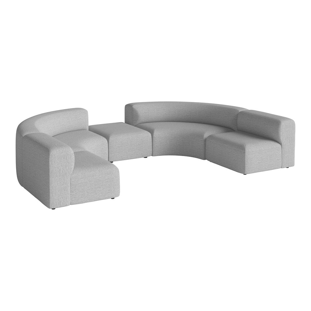 Curved modular sofa in soft light gray fabric, featuring a smooth texture and modern minimalist design.