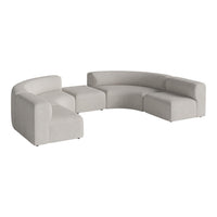 Light gray curved sectional sofa with minimalist design and soft, textured fabric. Perfect for modern living spaces.
