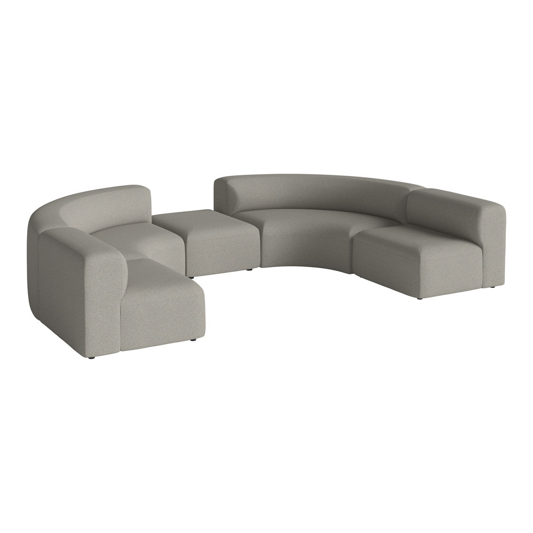 Gray modular sectional sofa with rounded edges and textured fabric for a modern, minimalist vibe.