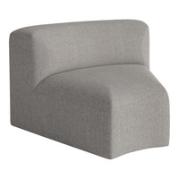 Grey modern accent chair with soft, textured fabric, featuring a minimalist design and curved edges. Ideal for contemporary decor.