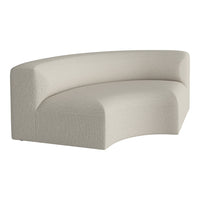 Curved sofa in soft beige fabric with a subtle, textured pattern for a modern, minimalist look.