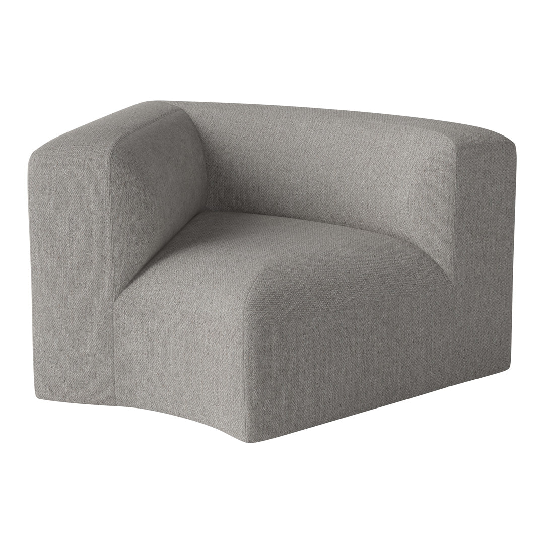 Stylish gray corner chair with a textured fabric and modern sculptural design, perfect for contemporary decor.