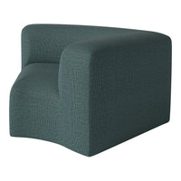 Teal upholstered corner chair with a textured pattern, showcasing a modern, minimalist design. Perfect for any space.