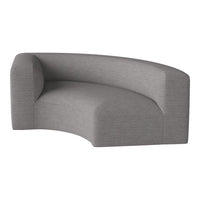 Curved sofa in a chic, light gray fabric with a subtle textured pattern for modern living spaces.
