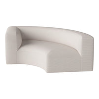 Curved sofa in soft beige fabric, featuring a subtle textured pattern for modern elegance.