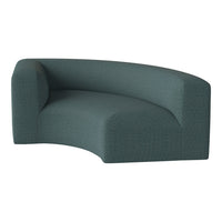Curved sofa in a deep teal color with a subtle textured pattern for a modern touch.