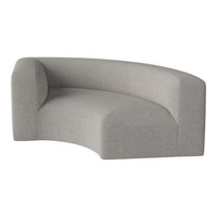 Light grey curved sofa with a smooth, textured fabric finish and minimalist design. Ideal for modern interiors.