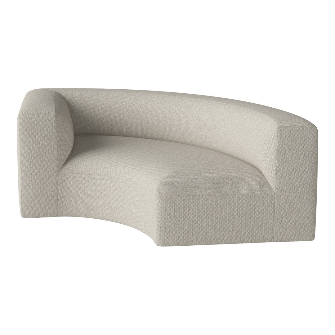 Curved sofa in soft beige with a textured fabric pattern, perfect for modern decor.