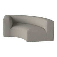 Curved sofa in soft light gray fabric with subtle textured pattern for modern interiors.