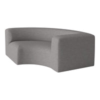 Curved gray sofa with a textured fabric, showcasing a modern and minimalist design. Perfect for contemporary spaces.