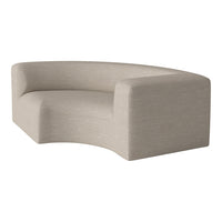 Curved beige sofa with smooth texture and subtle woven pattern, perfect for modern living spaces.