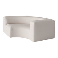 Curved white sofa with a soft, textured fabric, featuring a minimalist design and smooth edges.