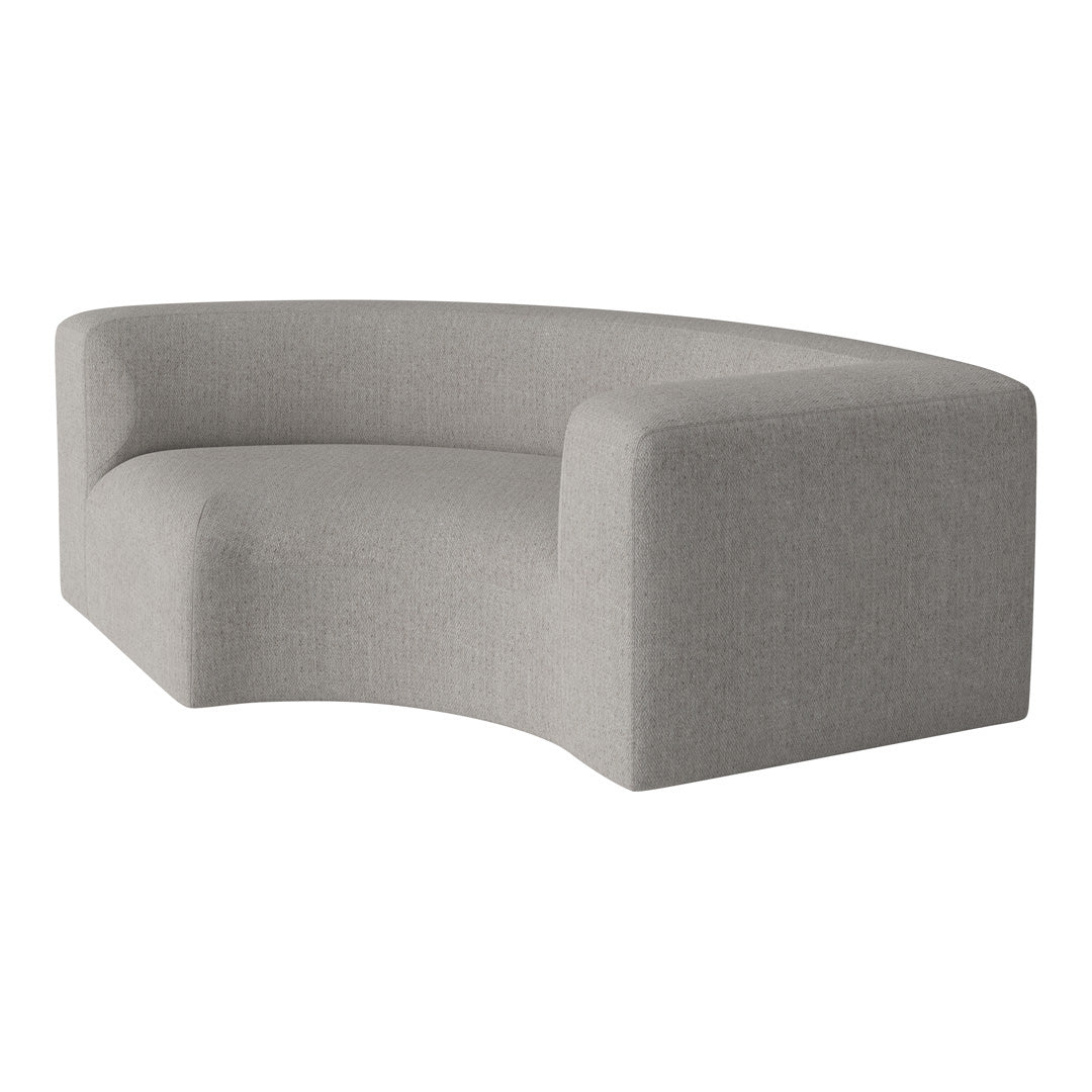 Curved grey sofa with a soft, textured fabric, enhancing modern minimalist decor.