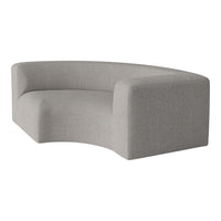 Curved grey sofa with a soft, textured fabric, enhancing modern minimalist decor.
