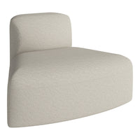Beige curved chair with a subtle textured weave for modern indoor decor. 
