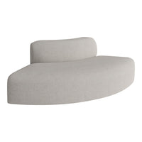 Light gray curved sofa with a smooth texture and minimalist design, perfect for modern interiors.