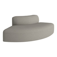 Curved sofa in soft beige fabric with subtle texture, perfect for modern home decor.