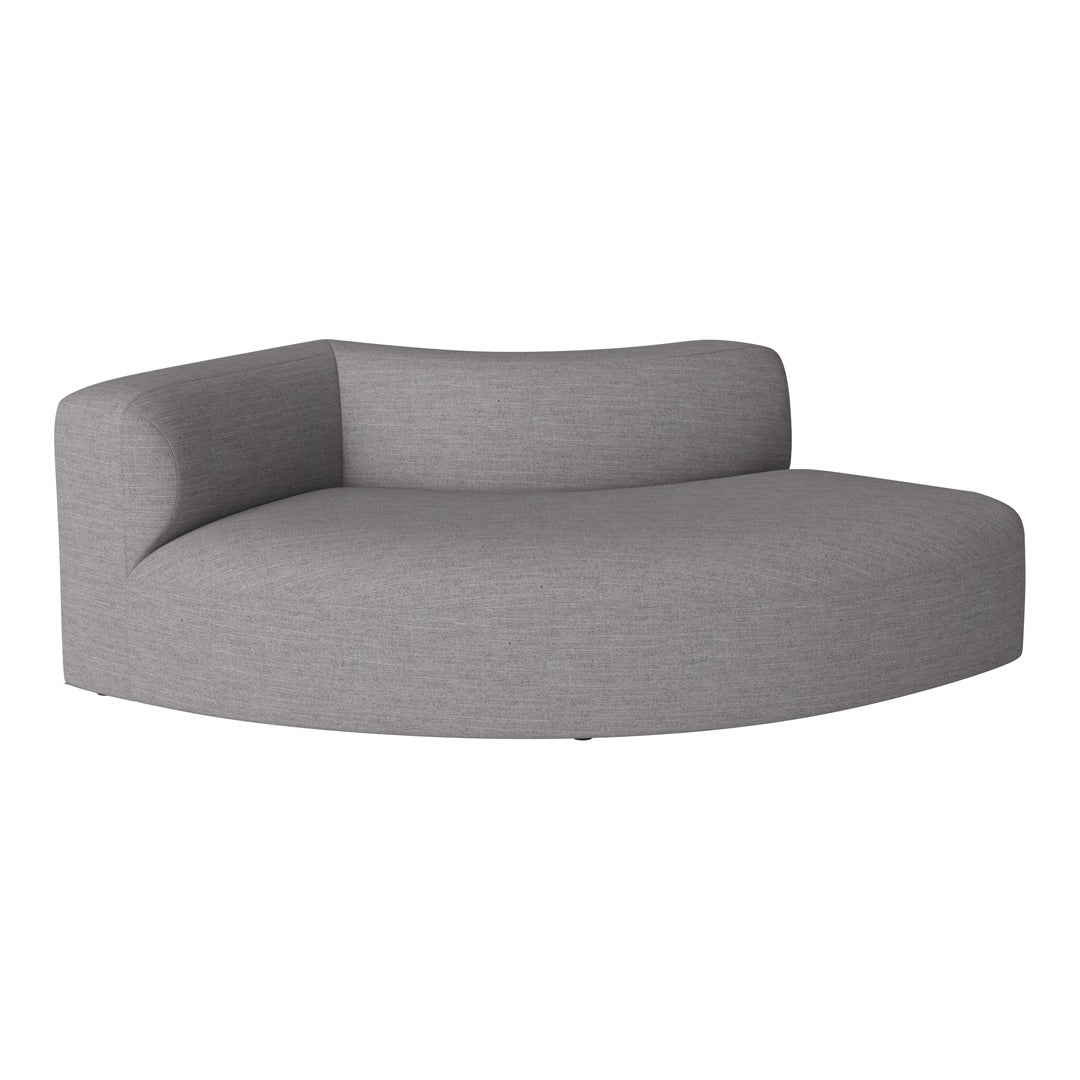 Curved gray sofa with a textured fabric, blending modern aesthetics and comfort in a minimalist design.