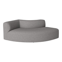 Curved gray sofa with a textured fabric, blending modern aesthetics and comfort in a minimalist design.