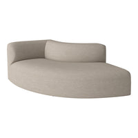 Curved beige sofa with a textured fabric surface, offering a minimalist and contemporary look.