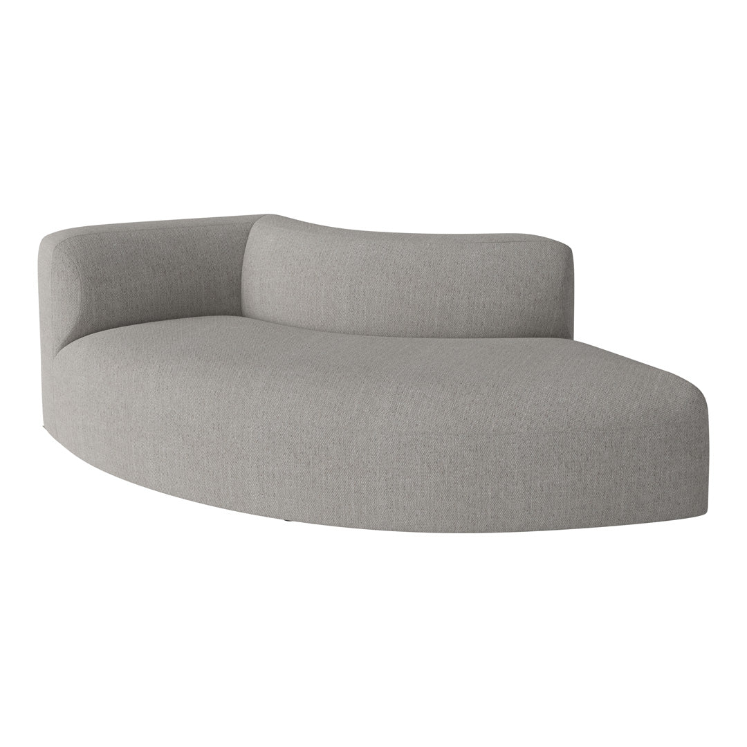 Curved gray sofa with a textured fabric, showcasing a minimalist design and soft, modern aesthetics.