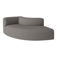 Curved sofa in soft gray fabric with a subtle textured pattern, perfect for modern living spaces.