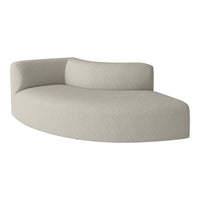 Curved sofa in soft beige fabric with subtle textured pattern, ideal for modern living spaces.
