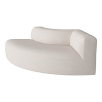 Curved contemporary sofa in soft beige upholstery with a subtle textured pattern, perfect for modern interiors.