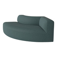 Curved teal sofa with a textured fabric, featuring a subtle pattern for modern elegance and comfort.