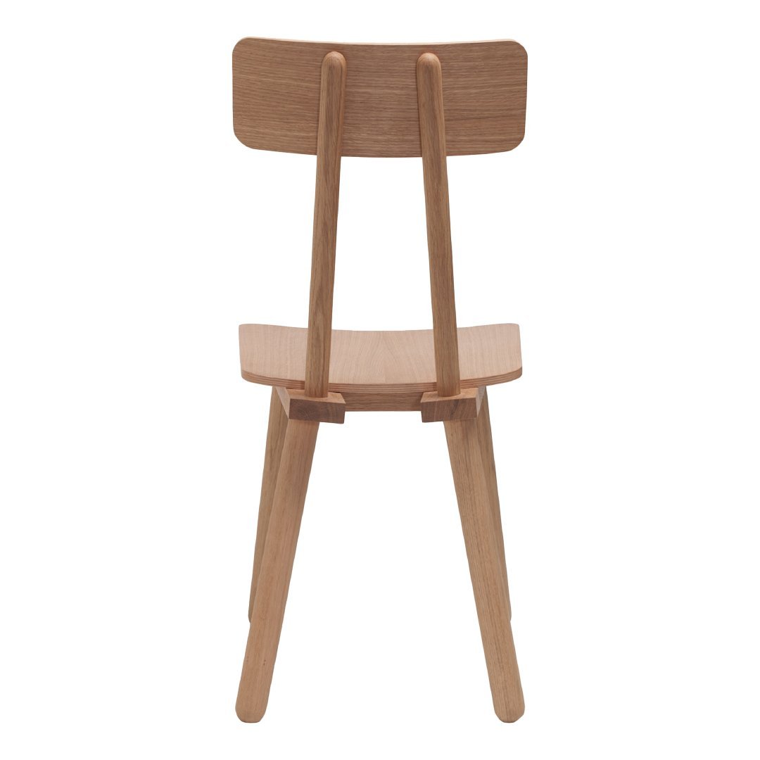 Natural wood chair with a simple, minimalist design and light brown finish.