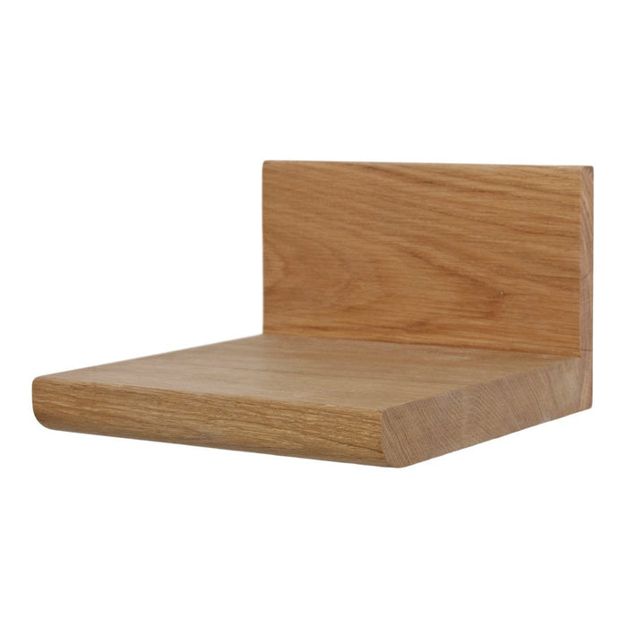 Natural oak floating shelf with a smooth finish, showcasing light wood tones and a minimalist design.
