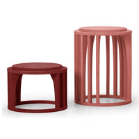 "Modern side tables in burgundy and dusty rose, featuring sleek, minimalistic patterns and contemporary designs."